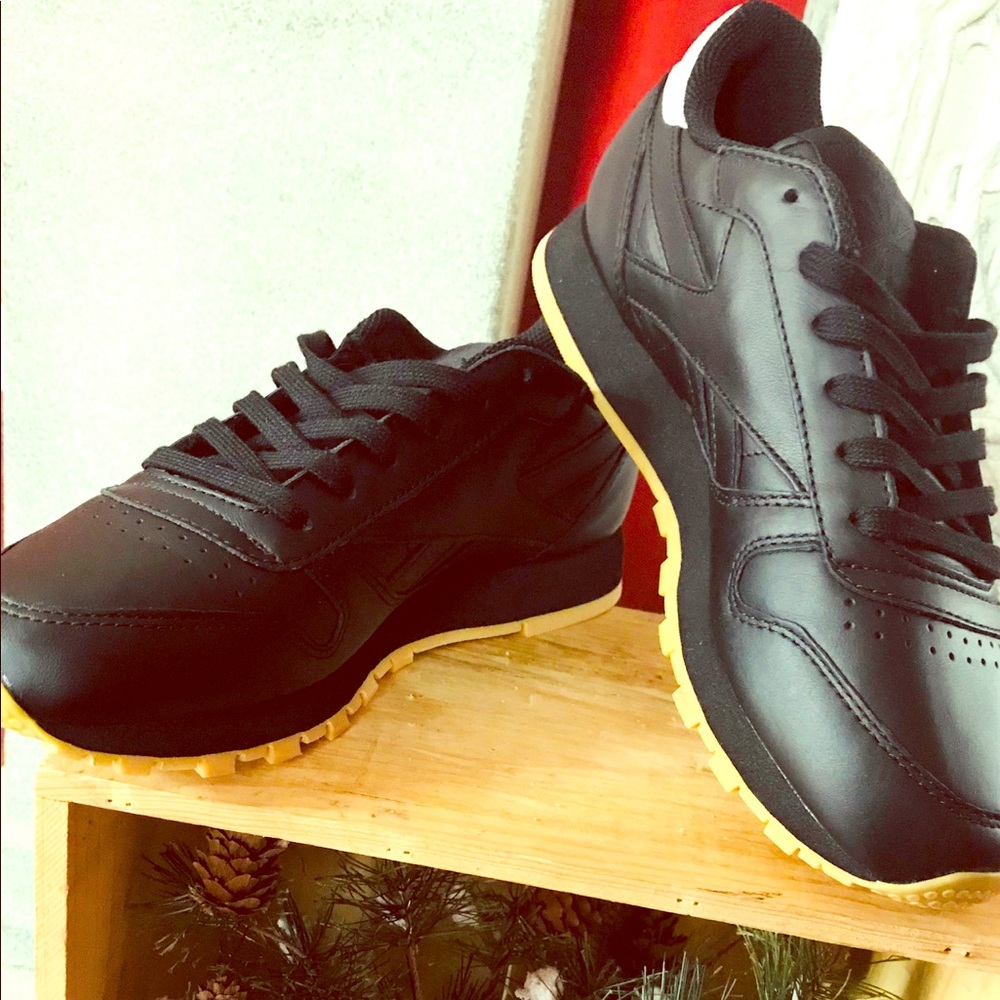 Reebok black leather sneakers